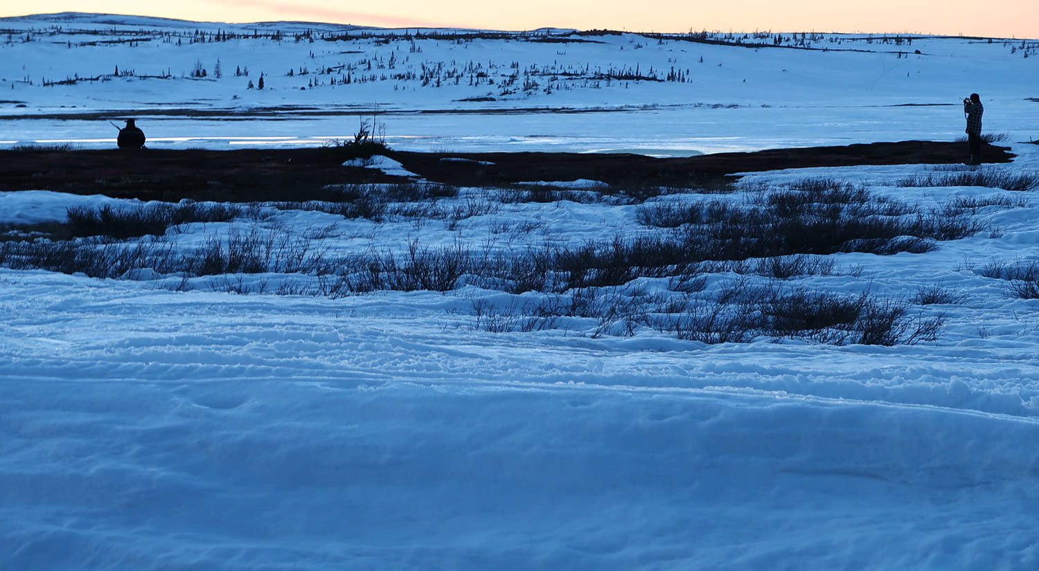 Two hunters seeking out spring geese at Ashuapun camp, 2016