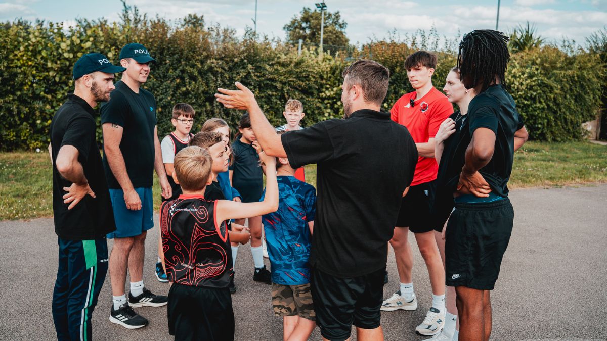 Essex Rebels stars and police officers speak to kids)