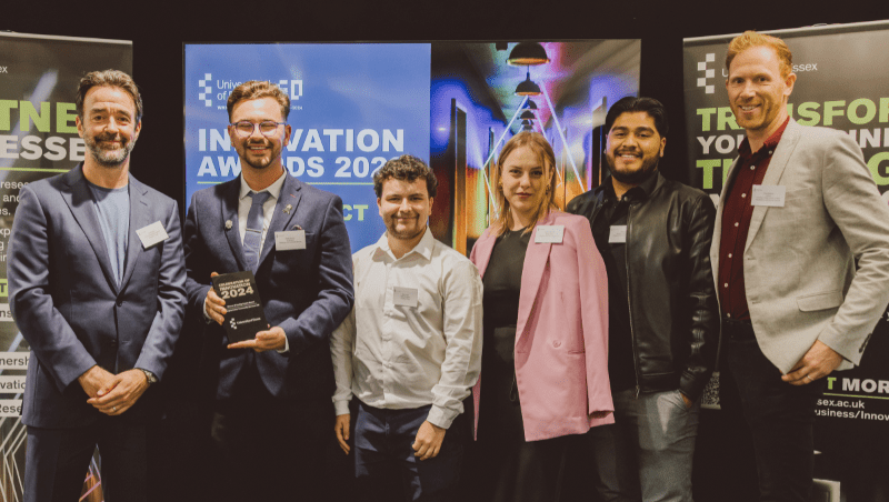 The Changing Lives team collecting their award from Pro-Vice-Chancellor Professor Chris Greer