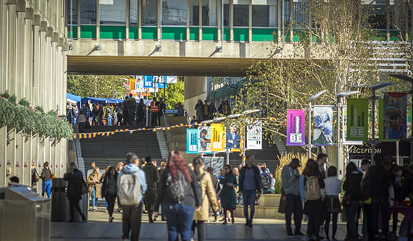 Lots of people walking through Square 3