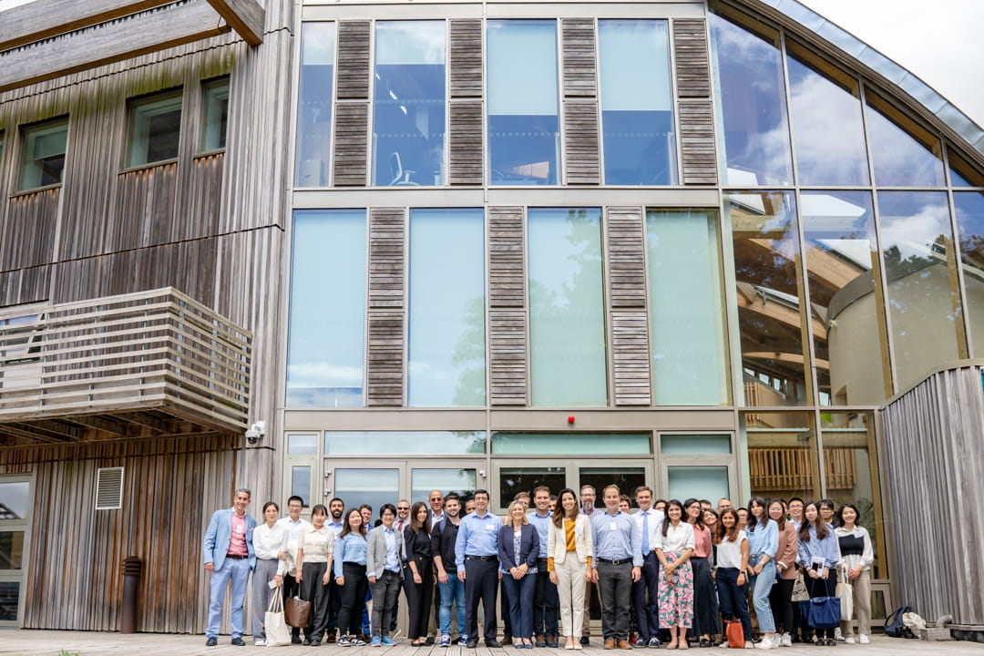 A group of people attending a conference standing outside Essex Business School