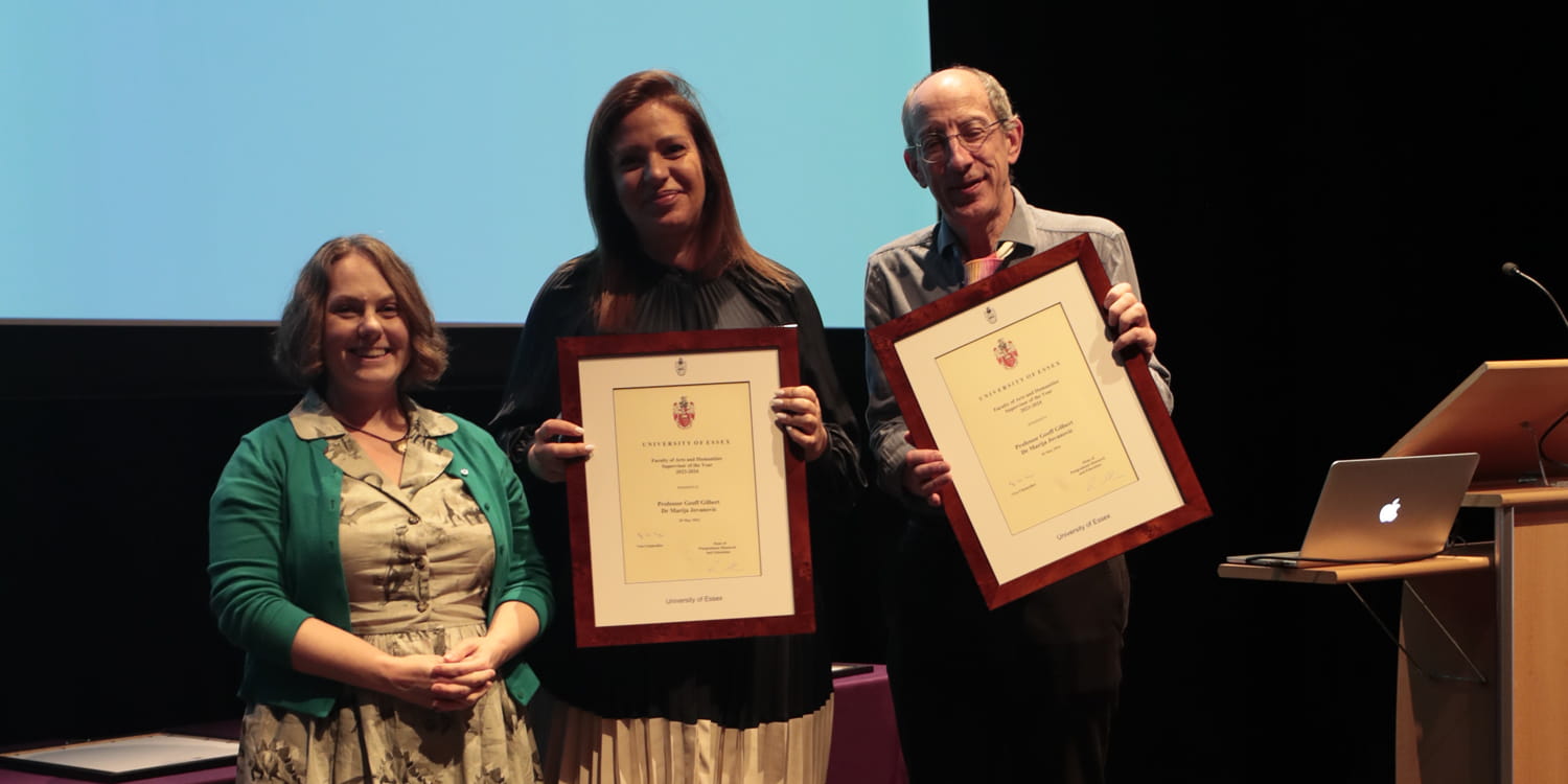 Professor Geoff GILBERT and Dr Marija JOVANOVIC receive framed certificates on stage.