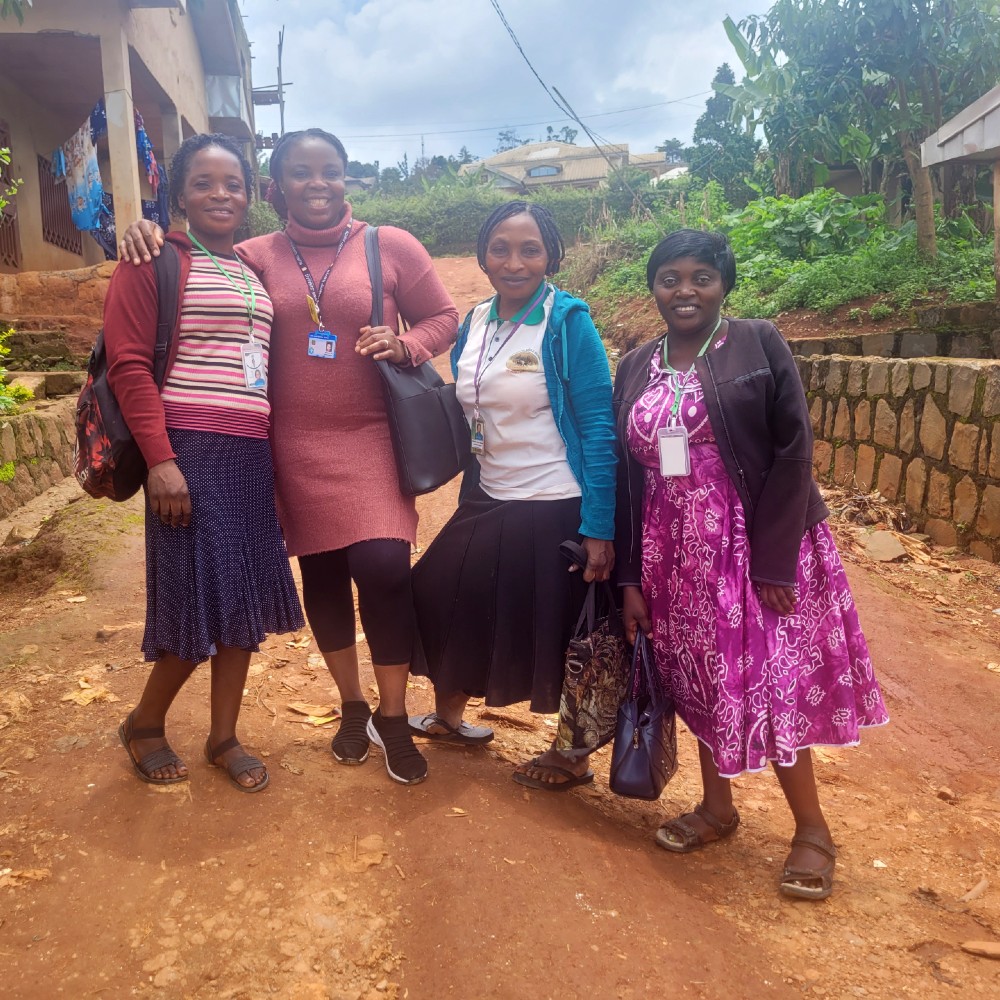 A student with a group of people in Cameroon whilst on a volunteer placement