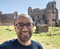 Abhimanyu Gupta smiling with castle in background