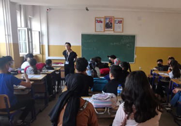 Elif Kubilay giving talk in classroom