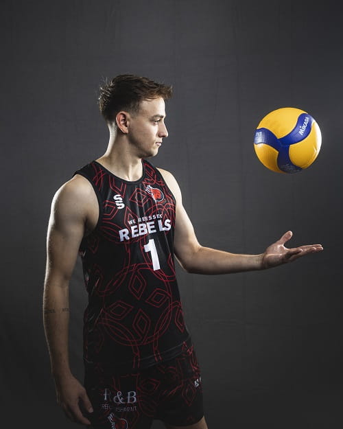 Men's Essex Rebels Volleyball player Ben Osborne media shot with volleyball