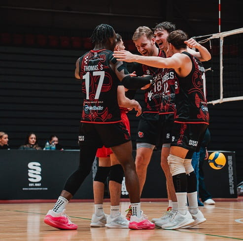 Essex Rebels men's volleyball team celebration huddle