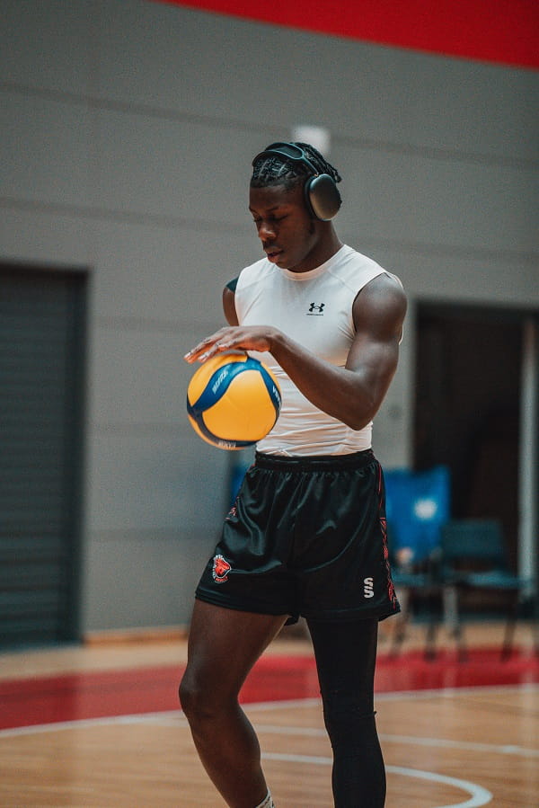 Essex rebels men's volleyball player Tom Shatimehin pre-game warm up listening to music