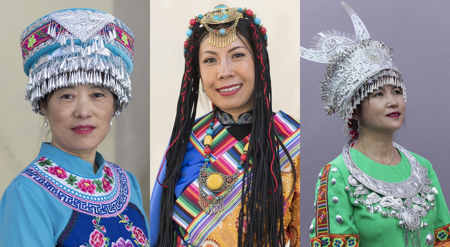 Cailian, Bai Lin, and Guiying, in the traditional clothing of their ethnic group.