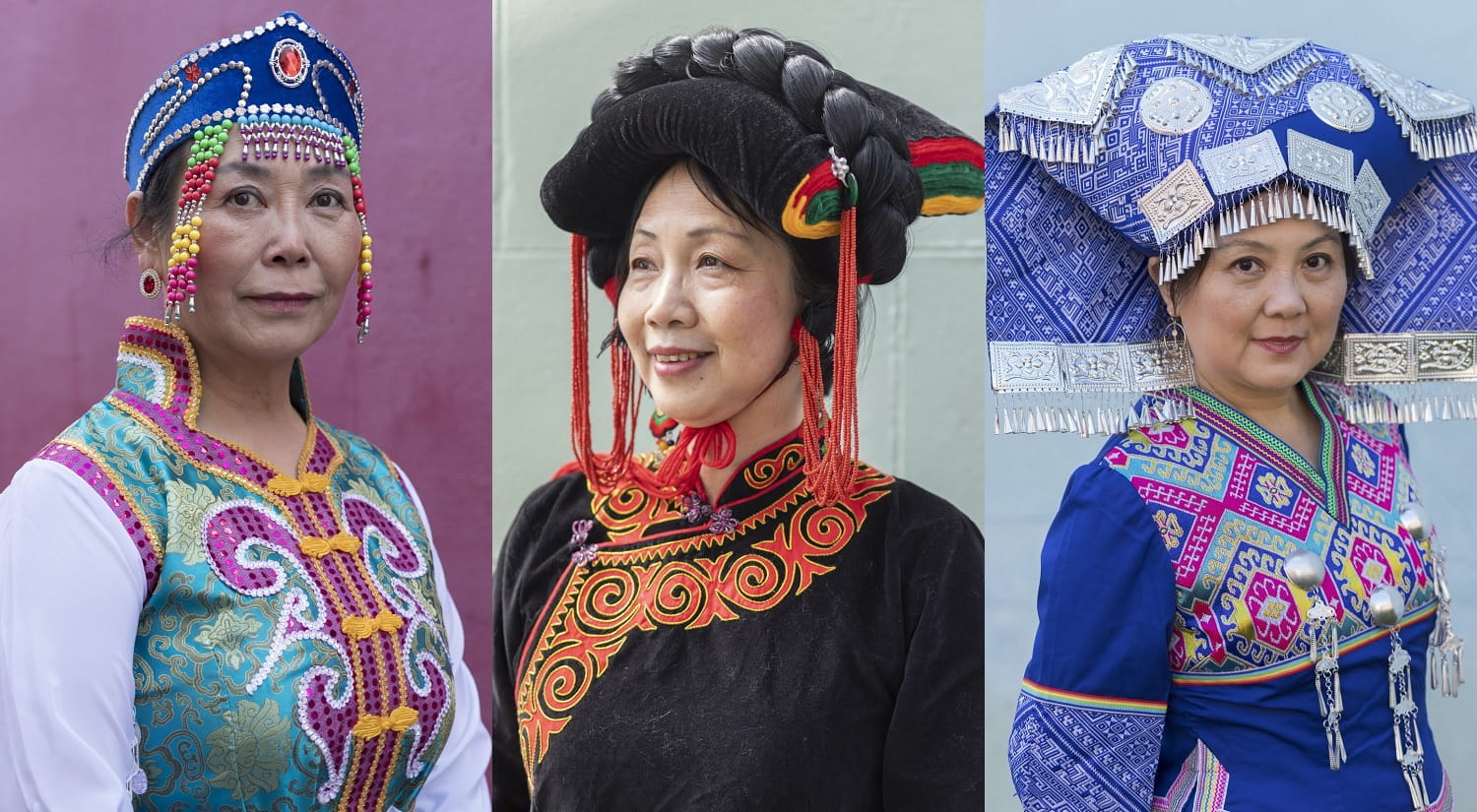 Guiying, Maofen, and Simone, in the traditional clothing of their ethnic group.