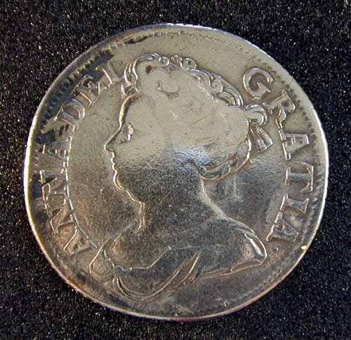 Silver shilling showing Queen Anne in profile, a lot of the definition has been smoothed down.