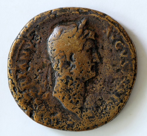 A brass sestertius (round coin), with a profile of the Roman Emperor Hadrian.