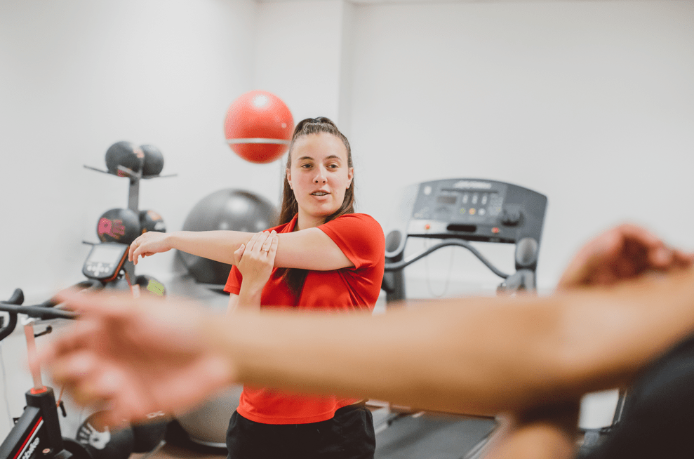 Sports Therapy student demonstrating a rehabilitation stretch.