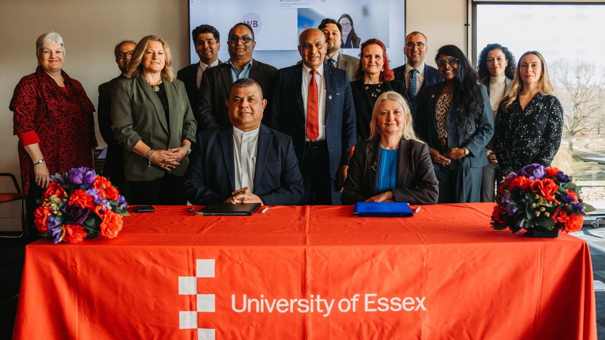 NIBM and Essex teams at partnership signing)