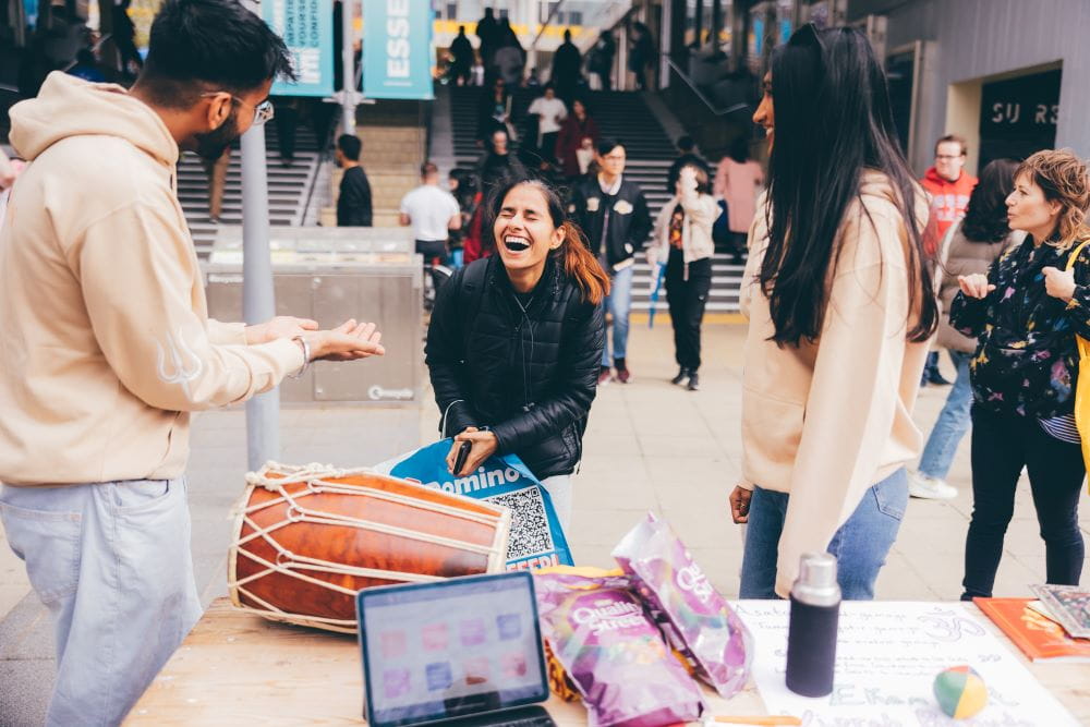 Students laughing on campus during Welcome Week