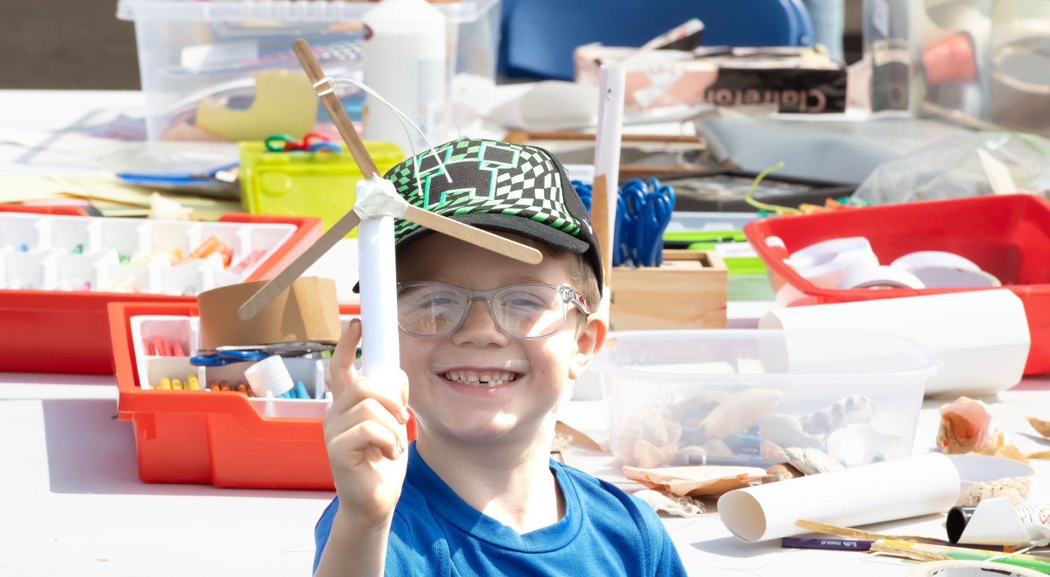 A child makes mini wind turbines