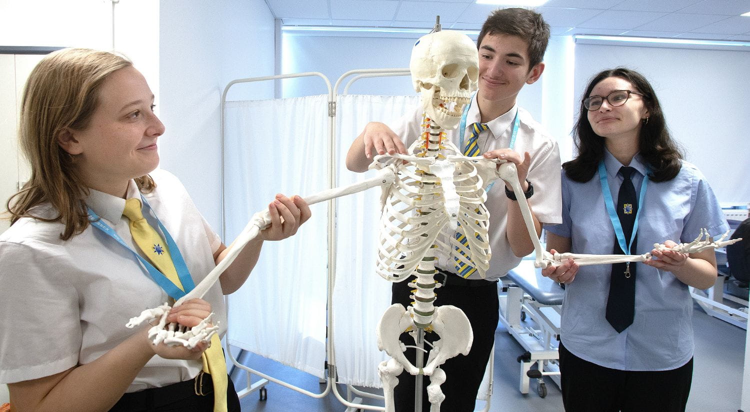 Clacton Coastal Academy students shake hands with a skeleton
