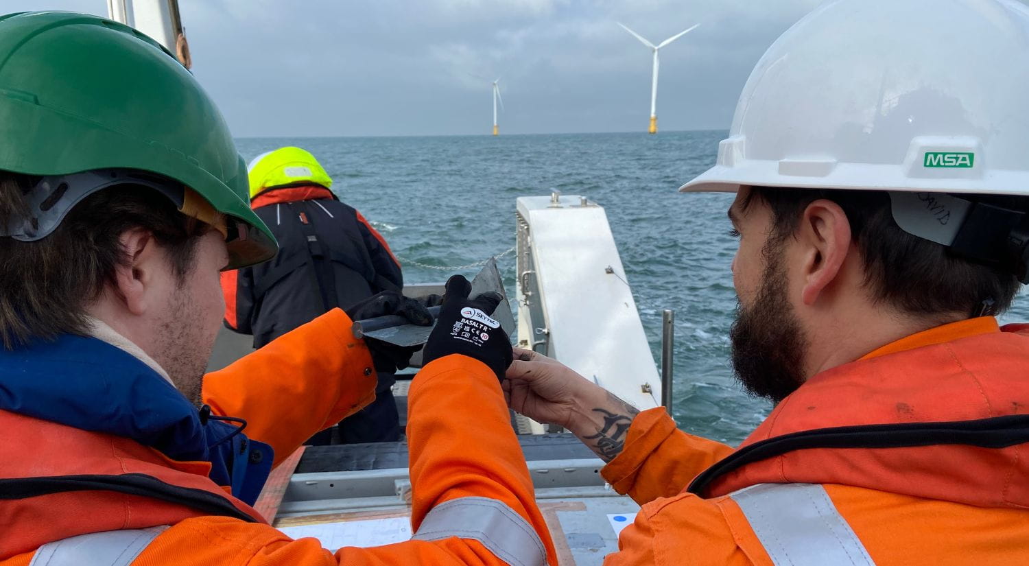 Essex researcher Hugo Woodward-Rowe and CEFAS' David Hughes look out to sea